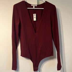 Express Burgundy long sleeve low cut body suit